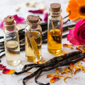 Set of three glass jars with vanilla pods and dried calendula and rose petals