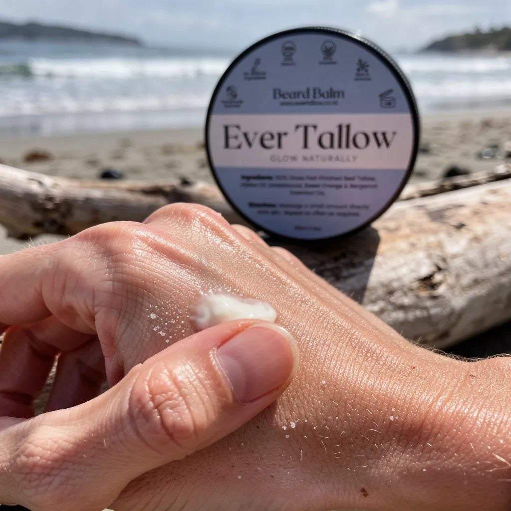 Ever Tallow beard balm being applied to a hand with a beach background