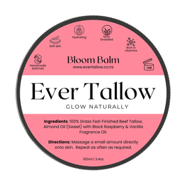 A round product label for Bloom Balm Ever Tallow, showing a pink and white design with black text and icons, on a plain white background.