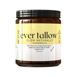 A 100ml amber glass jar of Ever Tallow 'Glow Naturally' fragrance oil with a black screw cap and a pale yellow and white label, shown on a plain white background.
