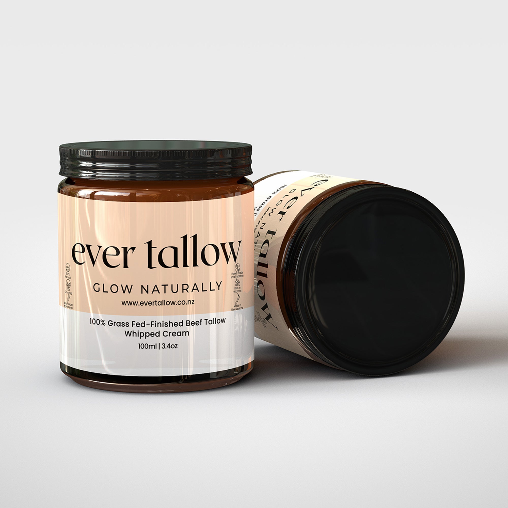 Two jars of Bar Tallow.  One jar is on its side