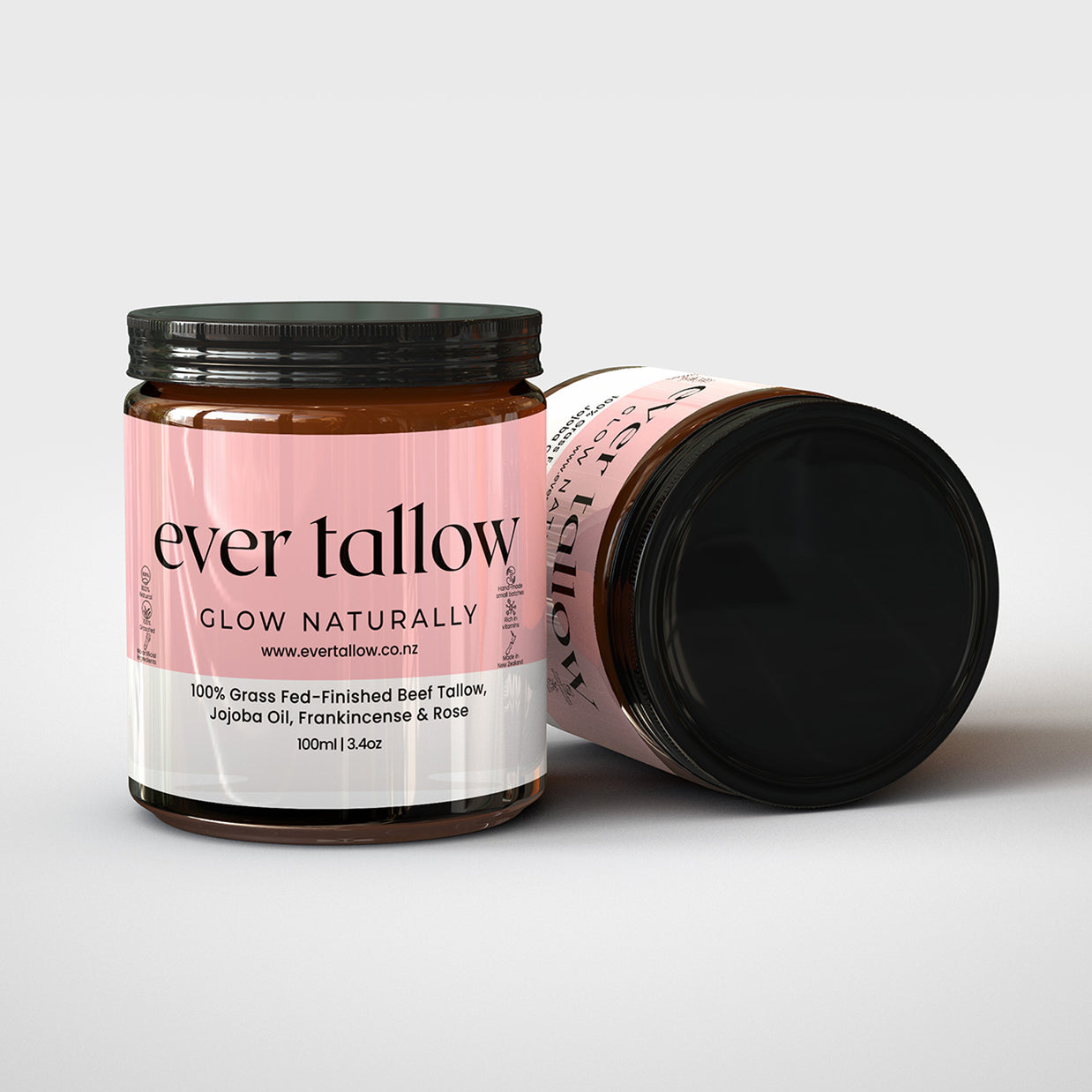 Beef Tallow with Jojoba Oil, Frankincense and Rose.  One jar is on its side